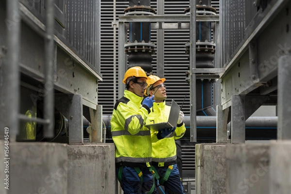 Obraz Industrial services. Repair and maintenance of water pipes network system. Team of engineer or technicians maintenance and repair pipes and fittings for industry system