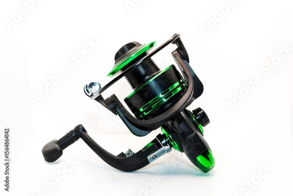 Obraz Green fishing reel with fishing line isolated on white background, ideal for outdoor activities sports. Photos from all angles and sides.