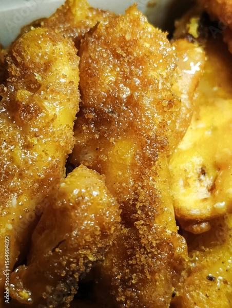 Fototapeta Close up of fried banana with brown sugar topping