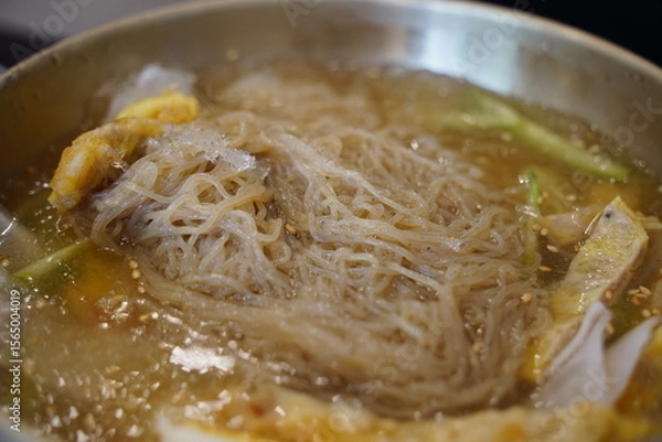 Obraz Close-up of Korean Naengmyeon Cold Noodles Topped with Sliced Beef Pancake (Yukjeon)