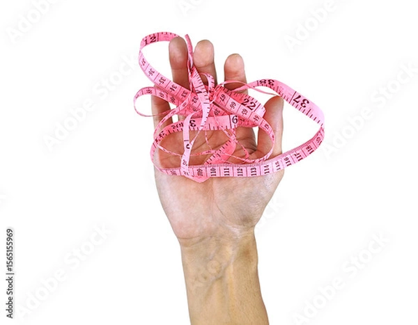 Fototapeta Hand Wrapped in Measuring Tape – Diet and Weight Control Concept
