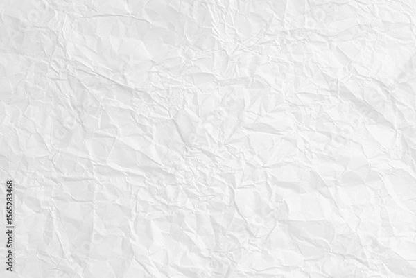 Fototapeta Abstract background of a white crumpled paper sheet. Blank wrinkled surface for a design and texture overlay.