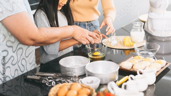 Obraz Grandmother cooking with daughter and mother family fun at home kitchen