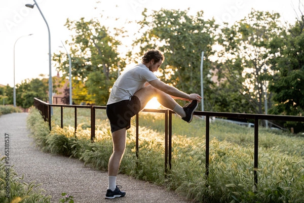 Fototapeta Scene of physical activity and wellness in a natural urban setting during sunset