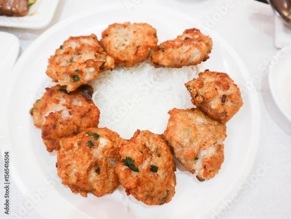 Fototapeta close up of Chinese dish pan fried lotus root minced cake presented in a round plate