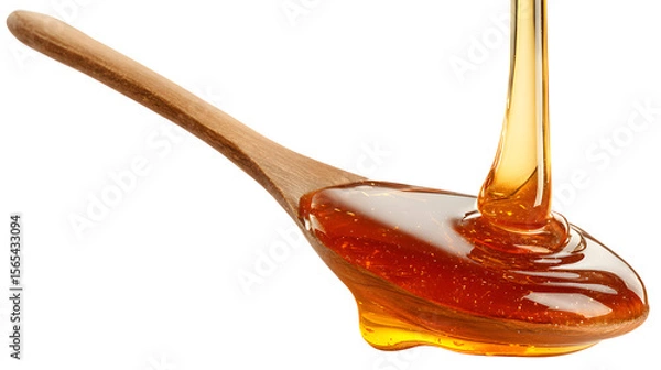 Fototapeta Honey dripping from a spoon isolated on a white background