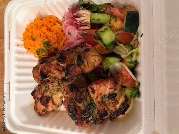 Fototapeta Grilled chicken with fresh salad and pickled vegetables in eco-friendly box