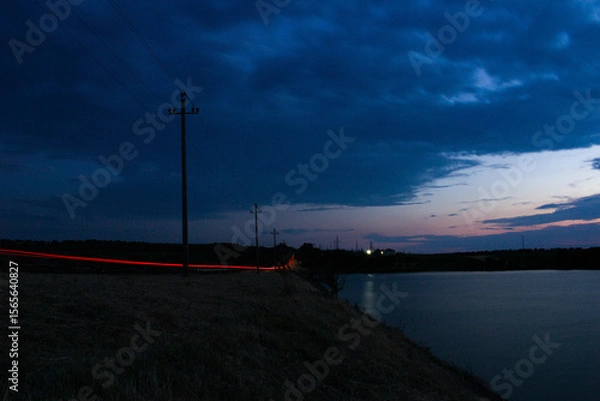Obraz A road with lights and a road