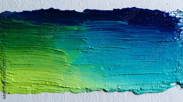 Fototapeta Close-up of vibrant oil paint strokes transitioning from lime green to deep blue.