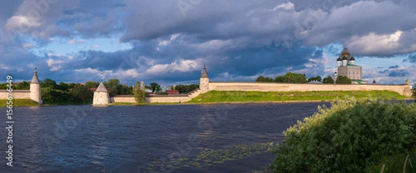 Fototapeta Beautiful panoramic evening view of the Pskov Kremlin from Olginskaya embankment. Pskov, Russia.