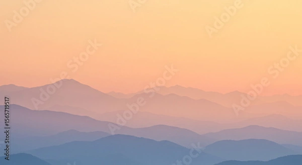 Obraz Mist over a faded pastel mountain range at sunrise, layered silhouettes with hazy transitions