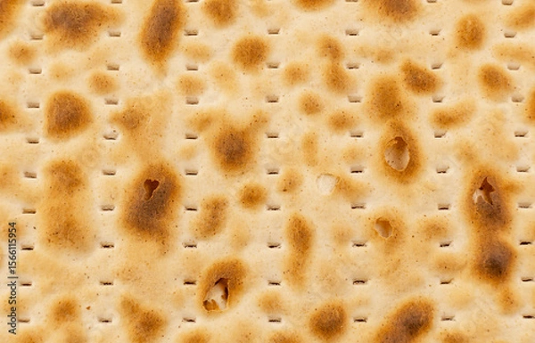 Fototapeta Close-Up Texture of Traditional Jewish Matzah Bread - Detailed Pattern of Unleavened Passover Crackers
