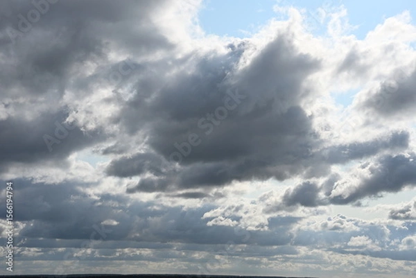 Fototapeta Cloudy sky. Specific shades of the sky, airiness, flight, the expanse of air. Photo 1