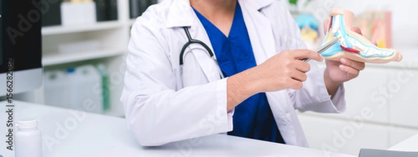 Fototapeta The doctor in orthopedics held a detailed and consultation at the hospital, guiding the patient through joint and tendon injury treatment for a smooth recovery process.