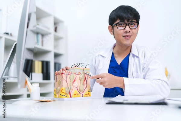Fototapeta The dermatologist at the hospital examined the patient’s skin, identifying symptoms linked to a follicle problem and offering treatment for better human skin protection.