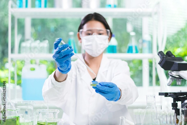 Fototapeta Scientist conducted research in biotechnology, using organic elements from nature to drive innovation and support the development of healthier food, Laboratory concept.