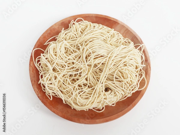 Obraz raw ramen noodle in wood plate isolated on white background. fresh egg ramen noodle isolated on white background. Japanese food ramen noodle isolated on white background