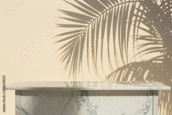 Fototapeta Luxurious marble table with a tropical palm tree shadow against a cream wall creates a perfect backdrop for product placement ideal for a copy space image