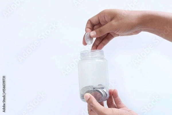 Fototapeta Saving money for the future. Saving money little by little