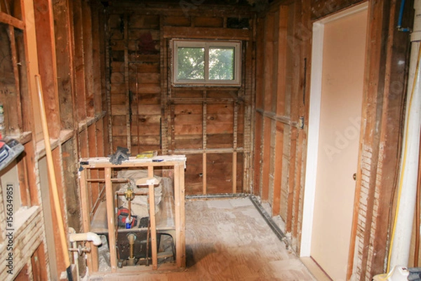 Obraz Bathroom Renovation Project in Partially Stripped Interior by Window