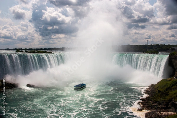 Obraz Experience the Power of Niagara Falls With a Boat Tour on a Sunny Day
