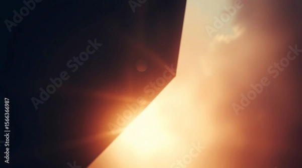 Fototapeta Abstract gradient texture with warm tones and a soft glowing light effect.