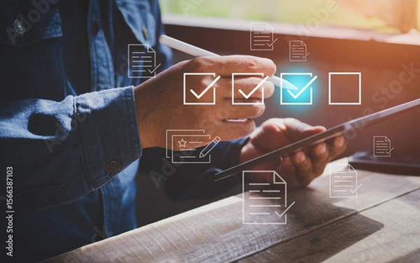 Obraz Businessman mark off items on digital checklist, Quality Assurance and Document Control Icons, representing quality assurance and document control processes, verification and compliance
