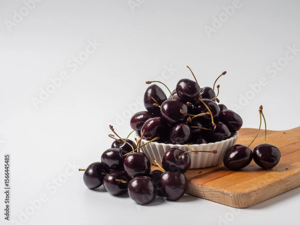 Fototapeta Sweet cherries with apricots isolated on white background cutout. Ripe berries closeup. Mix berries and fruits.