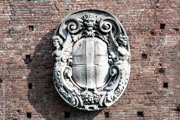 Obraz Coat of arms bas-relief on the wall of Sforza castle in Milan, Italy. Ancient restored coat of arms bas-relief on the wall of castle.