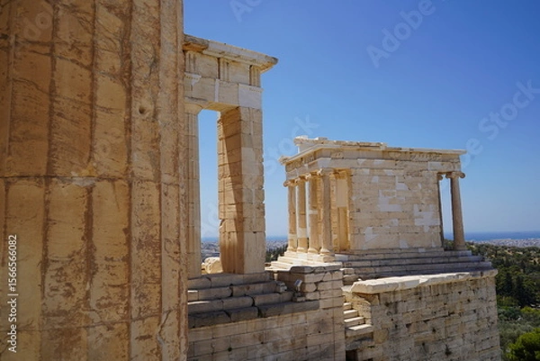Obraz Exploring the ancient architecture of Athens reveals intricate details and stunning vistas beneath a clear blue sky