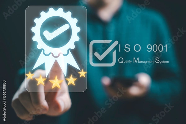 Fototapeta Businessman is interacting with a digital display showcasing ISO 9001 certification and a quality management system for emphasizing a commitment to excellence and quality assurance concept.