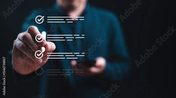 Fototapeta Businessman using electronic pend tick correct tick sign mark to checklist for quality assurance and certification concept.