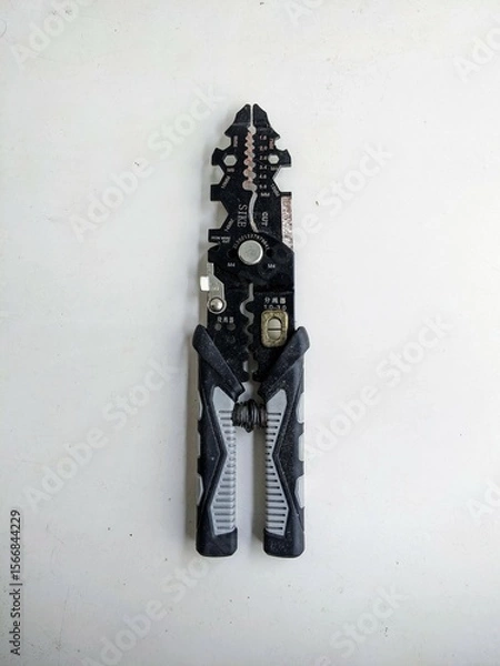 Fototapeta Professional wire stripper and cutter tool in a closed position, isolated on a white background. Electrician or handyman equipment.