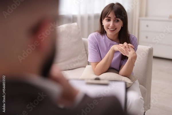 Fototapeta Professional psychologist working with patient in office, selective focus