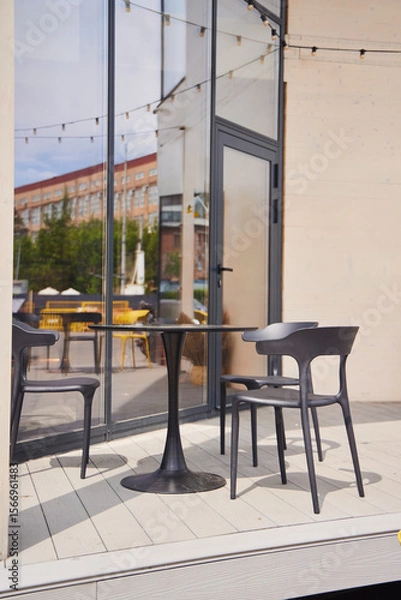 Fototapeta Tables and chairs on the street, cafe in the park
