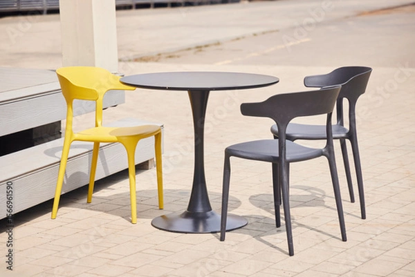 Fototapeta Tables and chairs on the street, cafe in the park