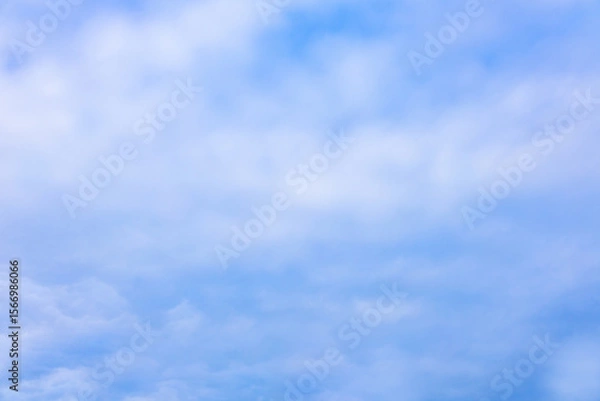 Fototapeta Beautiful blue sky and white fluffy group of clouds background in the morning skyline