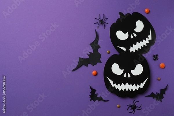 Fototapeta Halloween festive background design featuring black pumpkins, bats, spiders and confetti. Top view, space for text