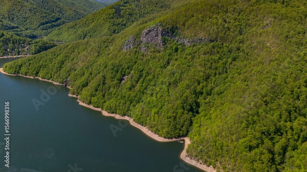 Obraz Aerial view of Piatra lui Lucaci rocky hill edge in forest near Tarnita Lake, Romania