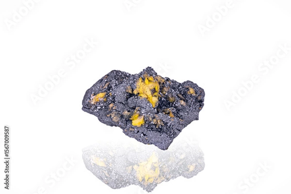 Obraz Yellow Sturmanite on black Manganite. Specimen from N'Chwaning 2, South Africa. photography isolated on white blackground. macro detail background. close-up mineral crystal unpolished