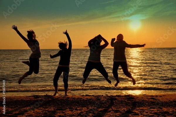 Obraz Teens jumping at beach