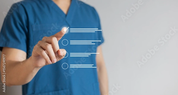 Fototapeta close up young general practitioner hand check mark box on medical checklist or opd record to read and diagnose and assess about patient's symptom for healthy and lifestyle concept