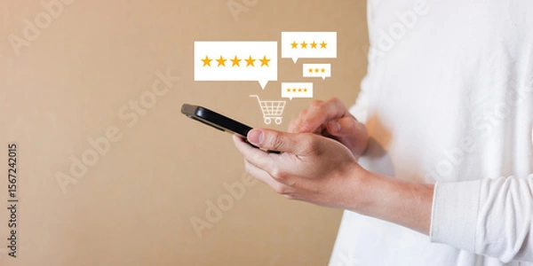 Fototapeta close up man hand hold smartphone and checking rating score of product on marketplace website before make cashless payment by credit card for customer satisfy and online shopping concept