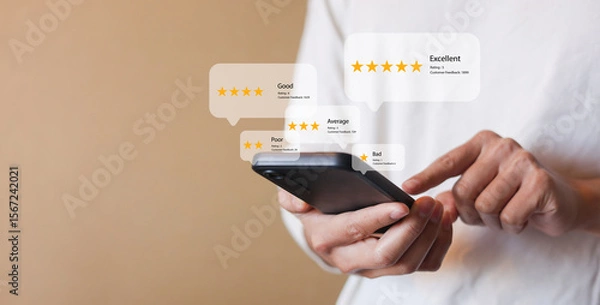 Fototapeta close up customer man hand hold smartphone to read comment on travel website and check survey online from office and give excellent rate for business lifestyle concept