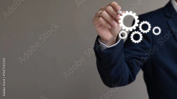 Fototapeta close up young businessman manager hand use stylus pen and draw gear setting for build or create about business process and solution concept with copy space background