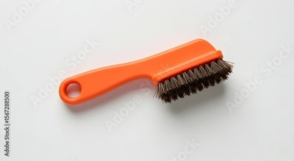 Fototapeta Compact Orange Handle Cleaning Brush with Stiff Bristles for Household and Shoe Care on White Background, Studio Shot