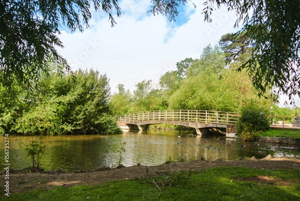 Fototapeta A bridge over a river at the park of Salisbury, England, UK.