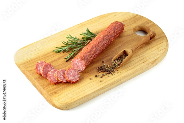 Fototapeta Sliced salami on a cutting board.