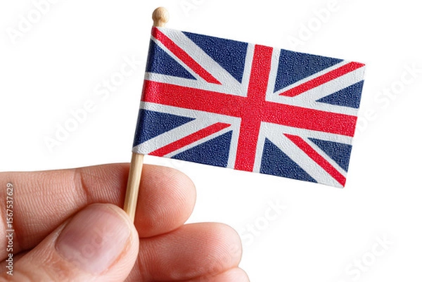 Fototapeta A small hand holds a toothpick flag of the United Kingdom, symbolizing national pride and identity.