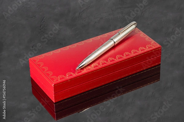 Obraz Fountain pen with box on dark gray background. Stationery branded items
